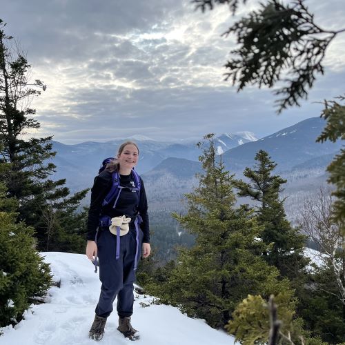 A photo of Mia Greco on top of a snowy mountain