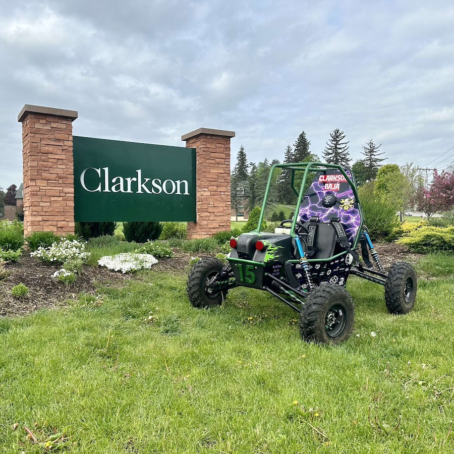 Baja SAE car out on the lawn next to the Clarkson sign