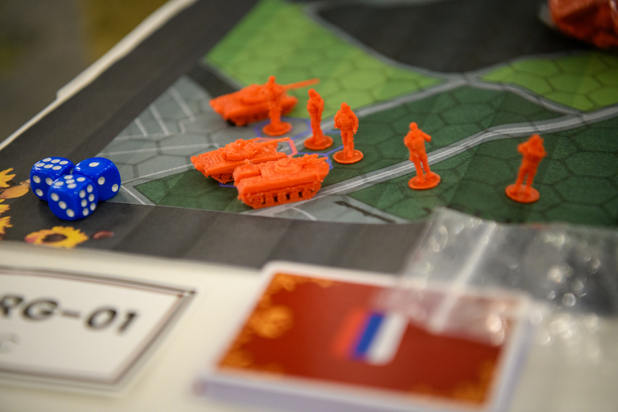 Small military figurines are placed upon a board game map.