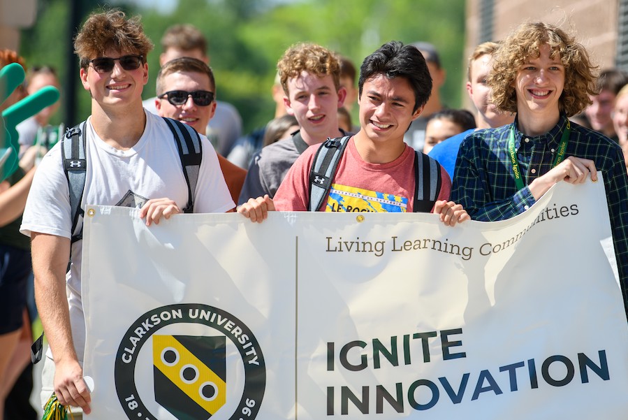 Students carrying an Ignite banner