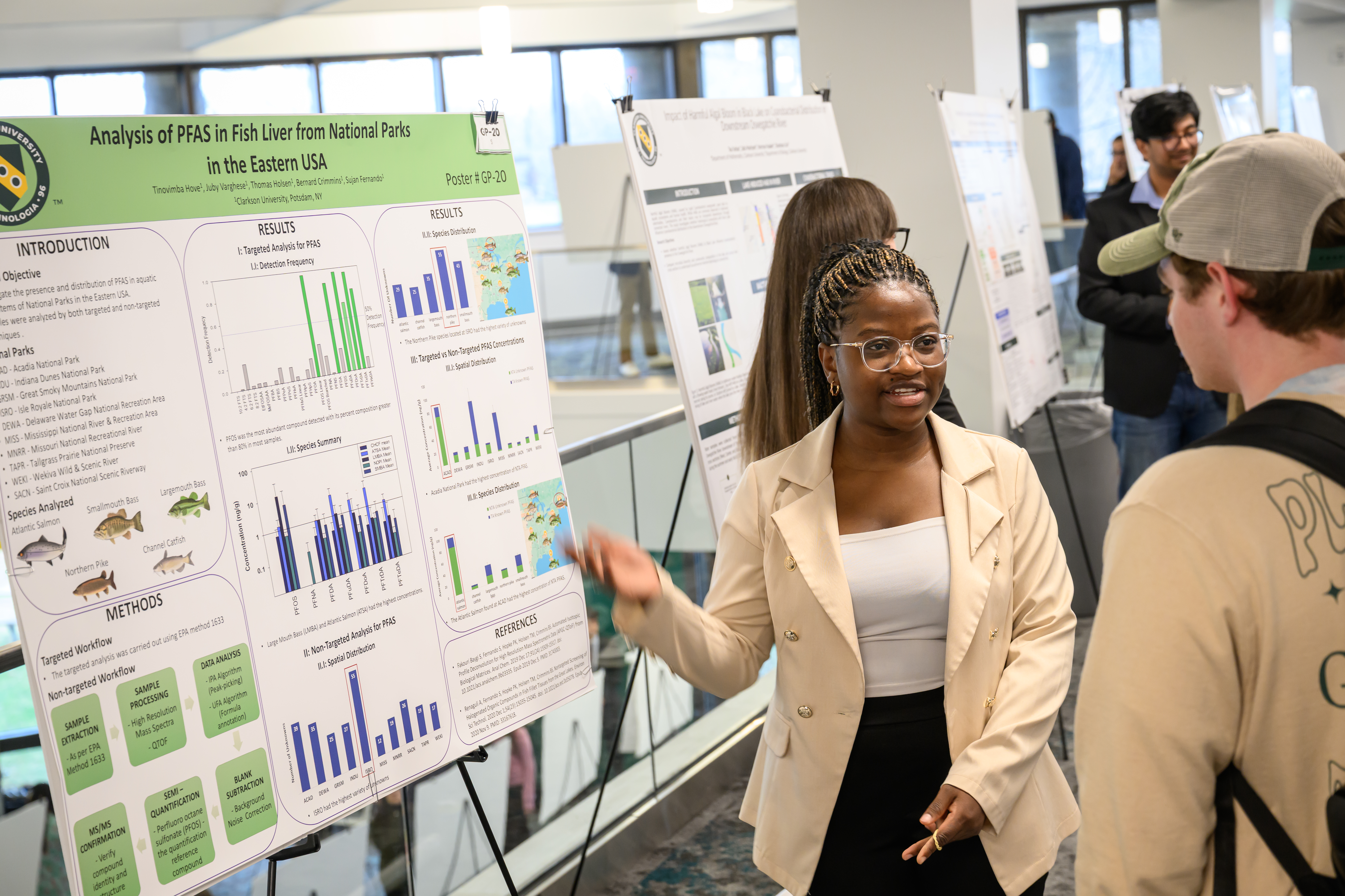 A photo of student presenting her Enviormental Analysis research. 