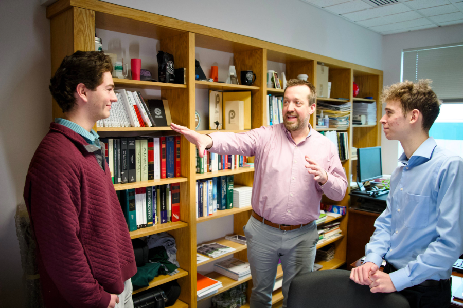Professor hosting office hours with 2 other students
