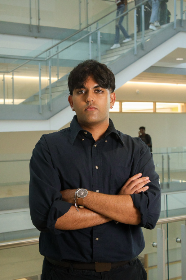 Headshot photo of Ankit Modhera with his arms crossed
